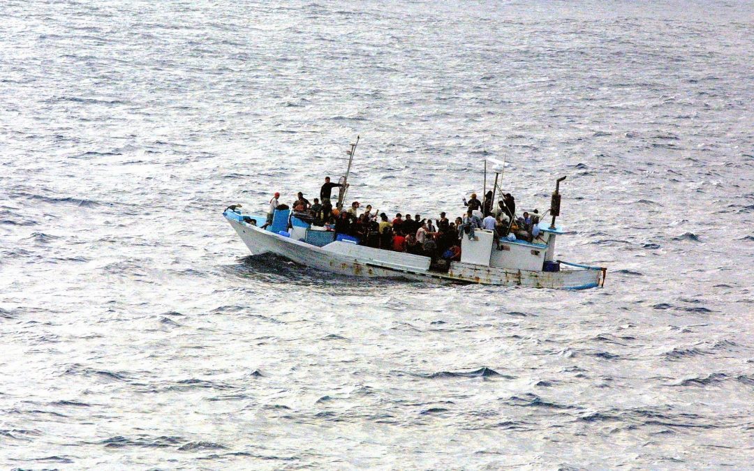 Photo of refugees crowded on a boat.