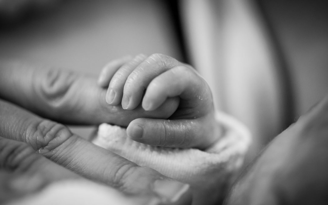 Photo of newborn hand.